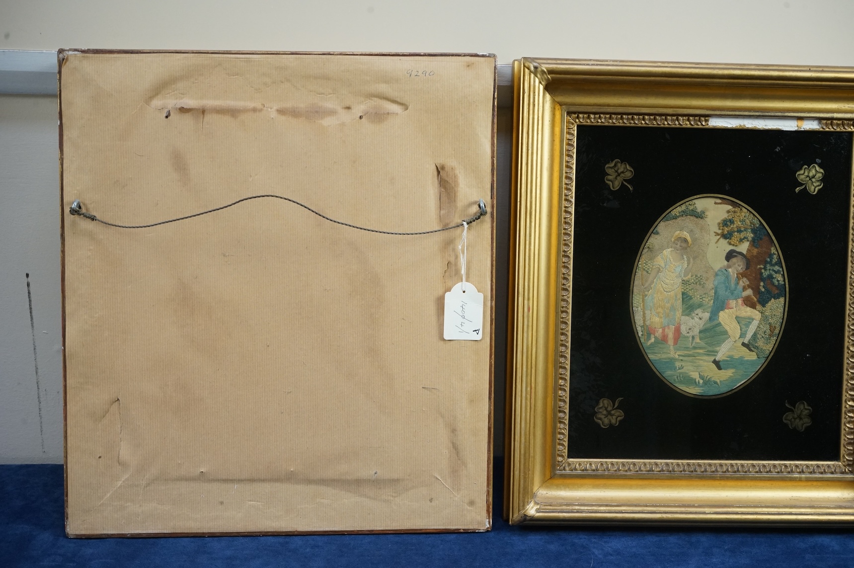 Two early 19th century oval silk worked embroideries. Both figural pastoral scenes, mostly worked in stem stitch, the leaves in a stump work style knotting. Both embroideries set within decorative Verre Eglomise glass an